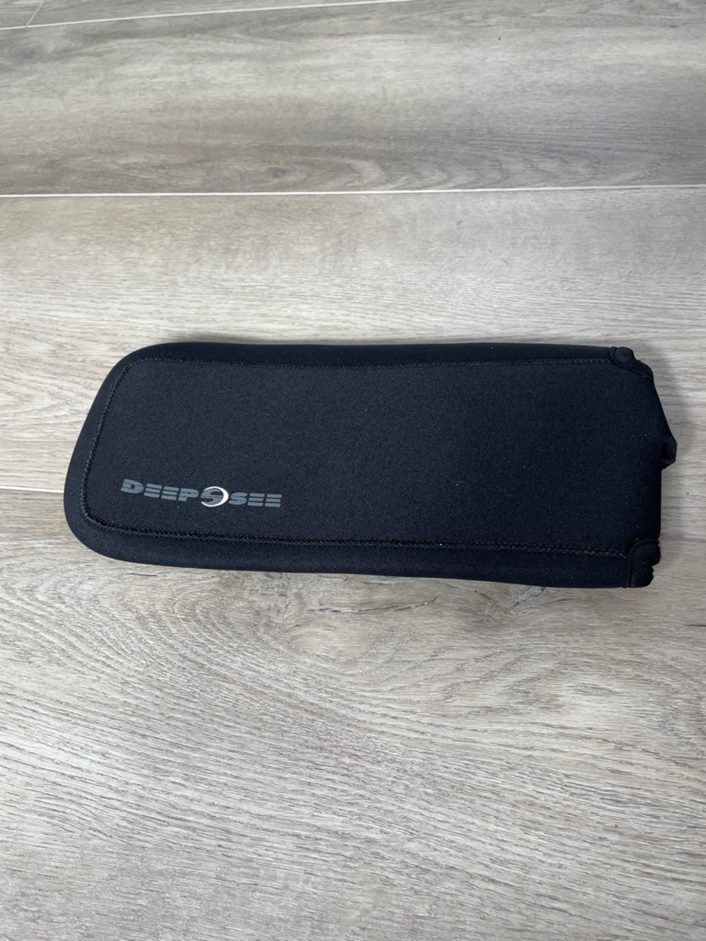DEEPSEE Black Neoprene dive computer pouch.